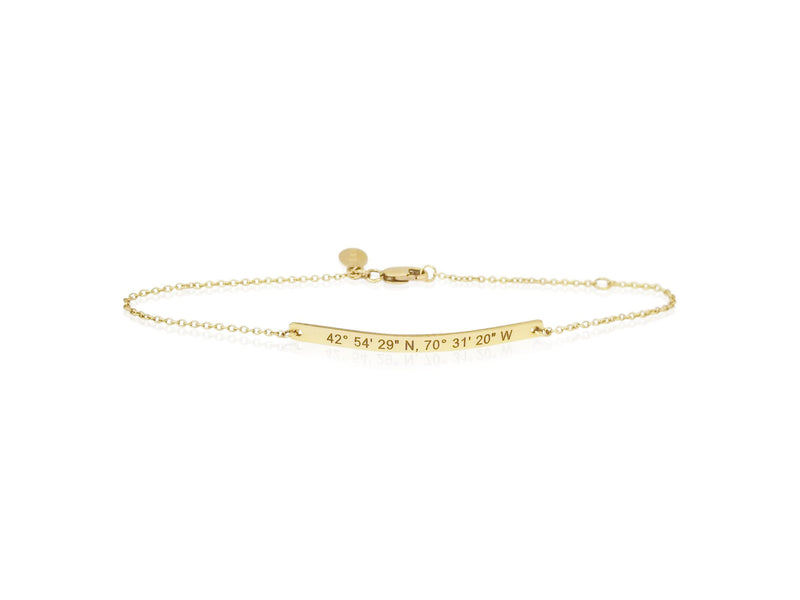 dainty coordinates bar bracelet by Lat & Lo in 14k gold-filled on model's wrist