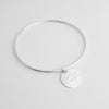 Lat & Lo charm bangle, sterling silver, engraved with coordinates, 16mm charm on wire bangle